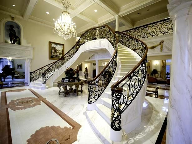 Mẹo chọn đá hoa cương chuẩn phong thủy theo mệnh gia chủ 1 CORTLAND, OH-January 12: The front entryway and staircase at the Ross Home. The couple spent $250, 000 on the metal work for the staircase. Brian and Kim Ross built their 75,000 sq ft home(including garages) a decade ago along a stream on 130 acres of property north of Youngstown. The home has been an inviting refuge for the Rosses and their 3 children, and their friends.